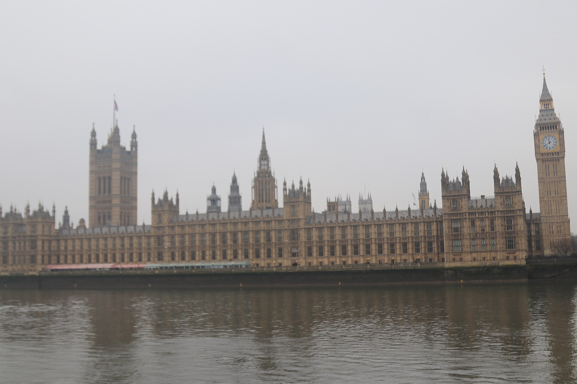 The Palace of Westminster and Elizabeth Tower seen from across the River Thames, London